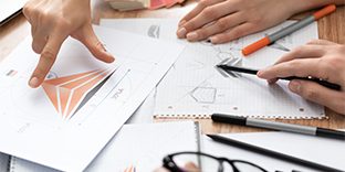 Graphic Designer Drawing Sketches Logo Design.