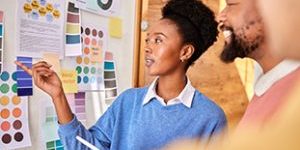Planning, Inspiration And Business People In A Meeting For Design, Brainstorming And Presentation. Color, Swatch And A Black Woman Speaking To Employees About Inspiration For Company Branding